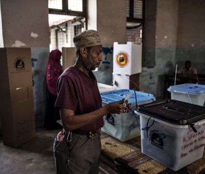A man prepares to cast his ballot at a polling station
