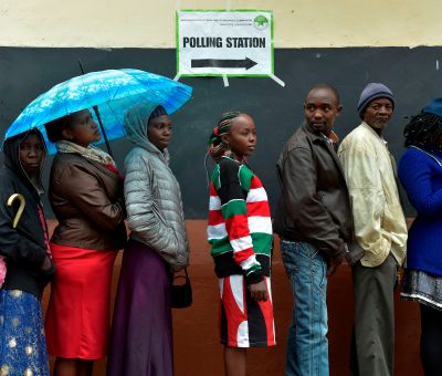 Voters queue at a polling station